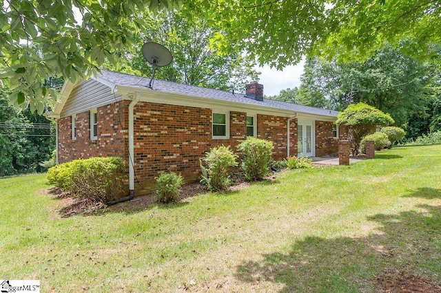 ranch-style house with a front lawn