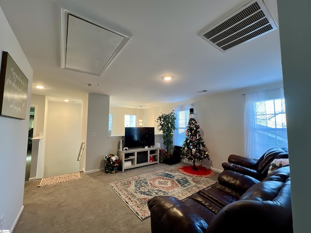 carpeted living room with a healthy amount of sunlight