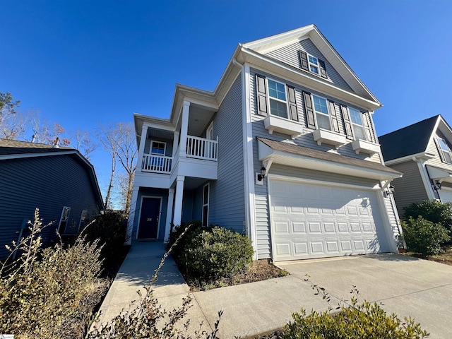 view of front of house featuring a balcony and a garage