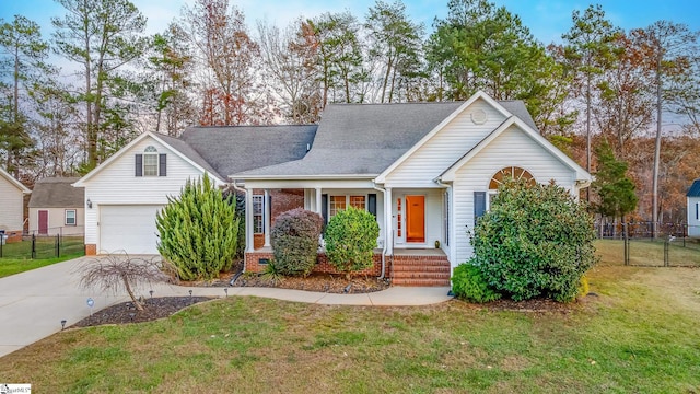 view of front of home featuring a front yard and a garage