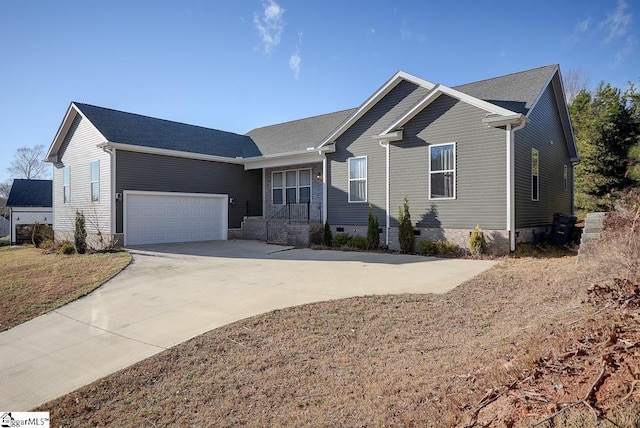ranch-style home featuring a garage and concrete driveway