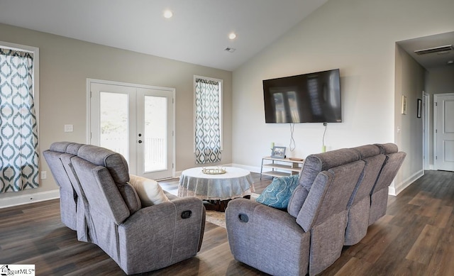 living room featuring lofted ceiling, dark wood-type flooring, and french doors