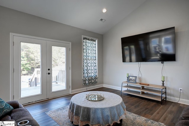 living room featuring lofted ceiling, dark wood-type flooring, and french doors