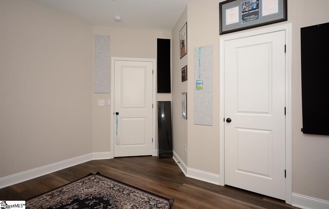 hall featuring dark hardwood / wood-style floors