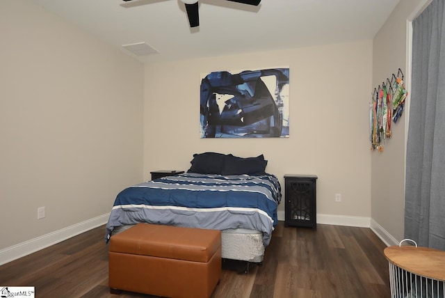 bedroom featuring ceiling fan and dark wood-type flooring