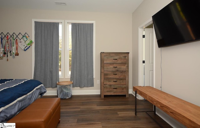 bedroom featuring dark wood-type flooring