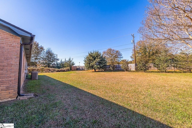 view of yard with central AC unit