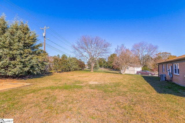 view of yard featuring central AC unit