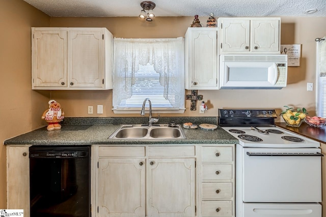 kitchen featuring a textured ceiling, sink, and white appliances