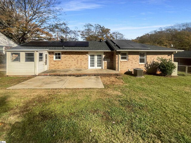 137 Batesview Dr, Greenville, SC 29607 - rear view of property with french doors, a patio, a yard, brick siding, and roof mounted solar panels