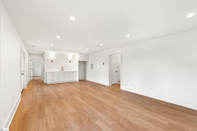 unfurnished living room with light hardwood / wood-style flooring