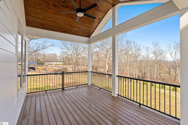 deck with ceiling fan and a yard