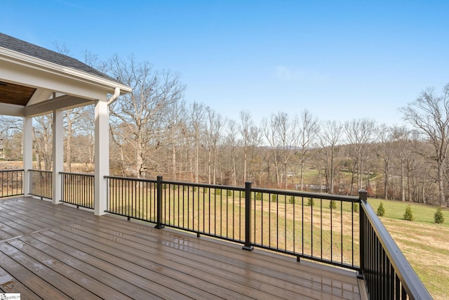 wooden deck with a yard