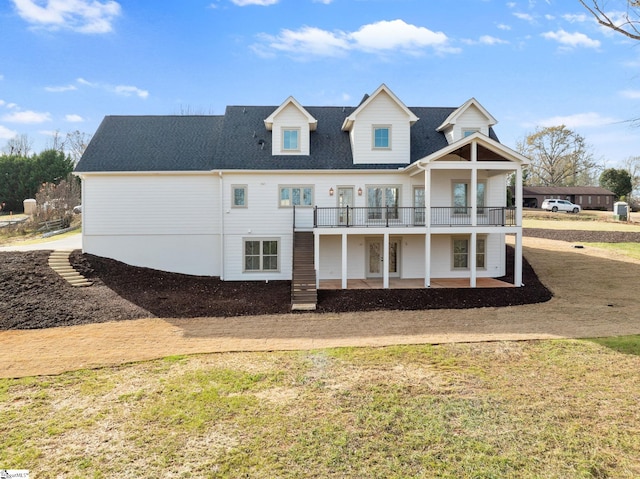 rear view of house with a yard