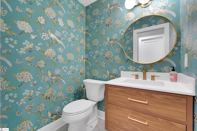 bathroom with tile patterned floors, vanity, and toilet