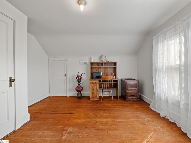 office area featuring hardwood / wood-style flooring and lofted ceiling