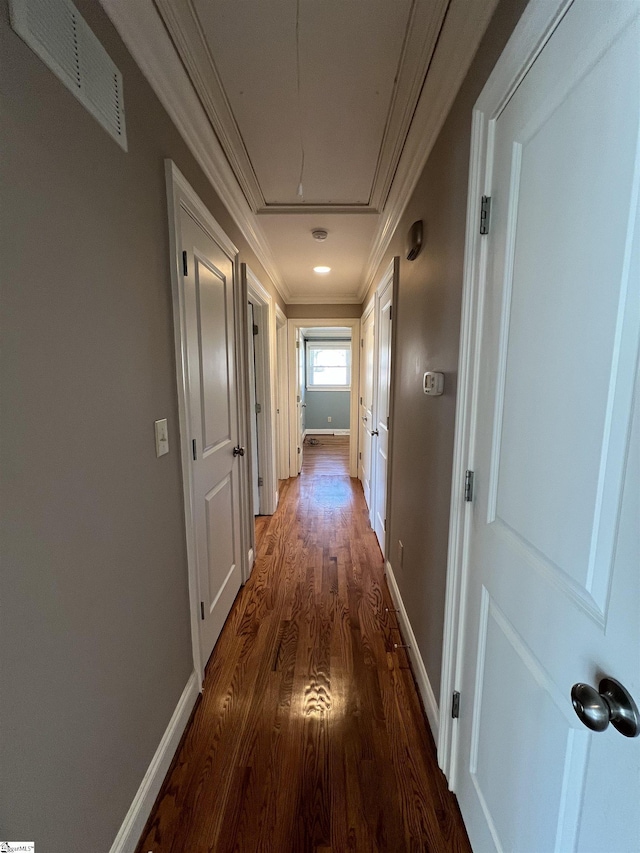 hall featuring dark hardwood / wood-style flooring and crown molding