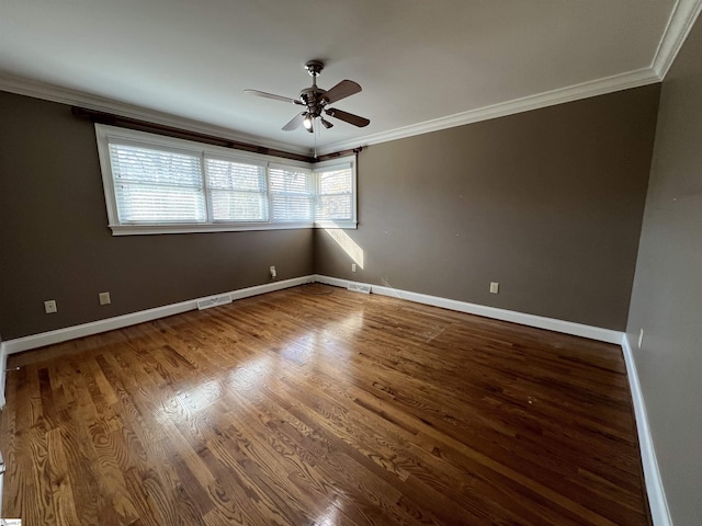 spare room with hardwood / wood-style floors, ceiling fan, and ornamental molding