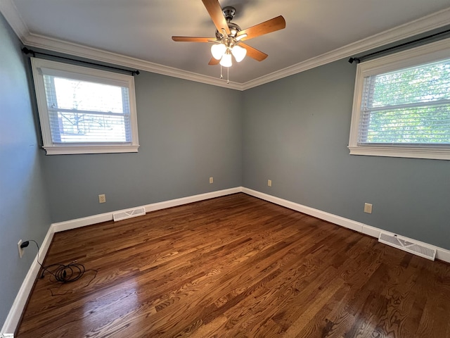 spare room with hardwood / wood-style floors, ceiling fan, and ornamental molding