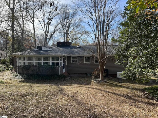 back of property featuring a sunroom