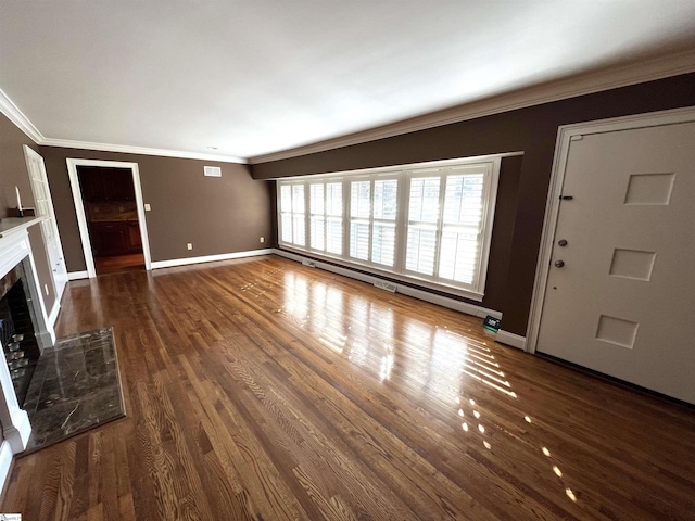 unfurnished living room with a tile fireplace, dark hardwood / wood-style flooring, and crown molding