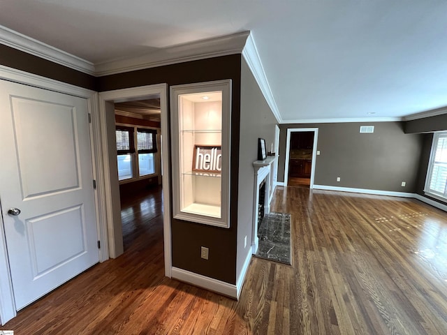 hall with crown molding and dark wood-type flooring