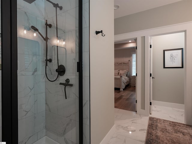 bathroom featuring hardwood / wood-style floors and tiled shower