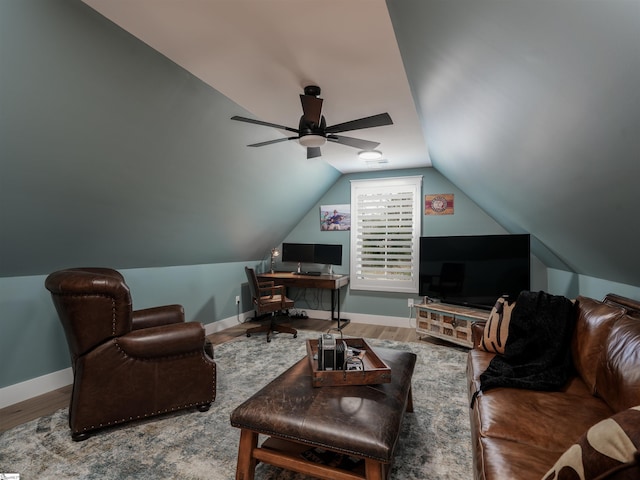 living room with ceiling fan, wood-type flooring, and lofted ceiling