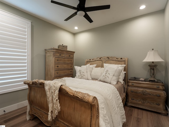 bedroom featuring ceiling fan and dark wood-type flooring