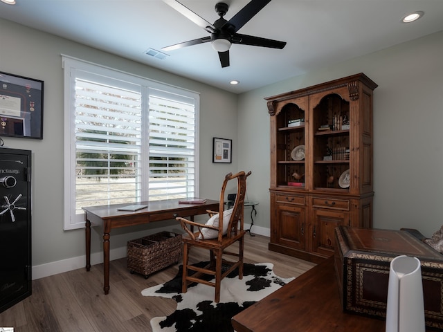 office space with ceiling fan and light wood-type flooring