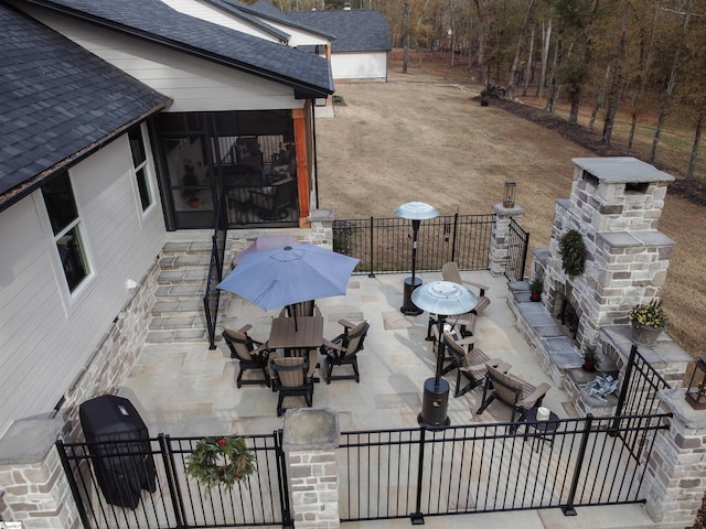 view of patio featuring grilling area and an outdoor stone fireplace