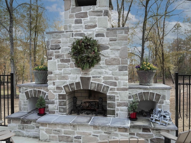 view of patio / terrace with an outdoor stone fireplace