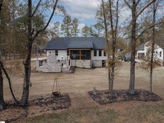 exterior space featuring a sunroom