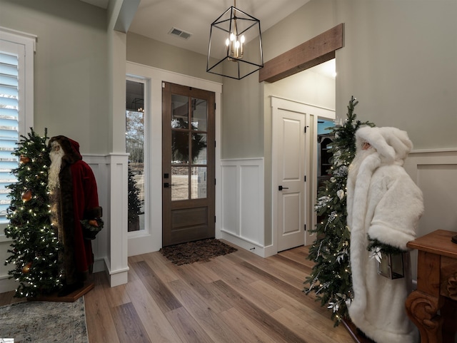 entrance foyer featuring a chandelier and light hardwood / wood-style floors