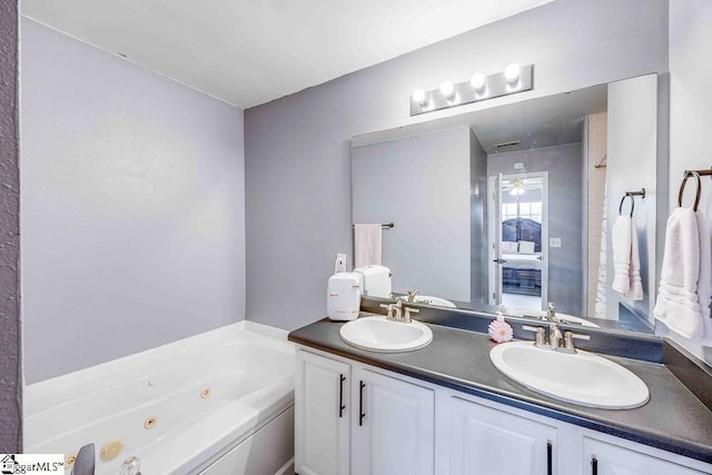 bathroom featuring a bathing tub and vanity