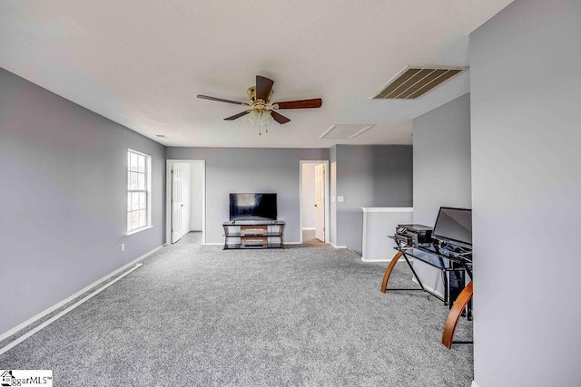 living room with carpet flooring and ceiling fan