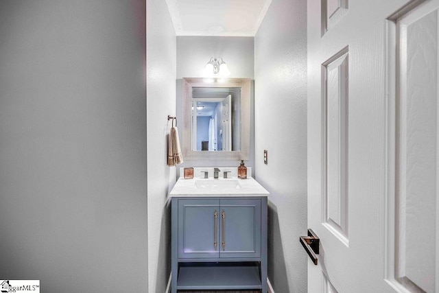 bathroom featuring vanity and crown molding