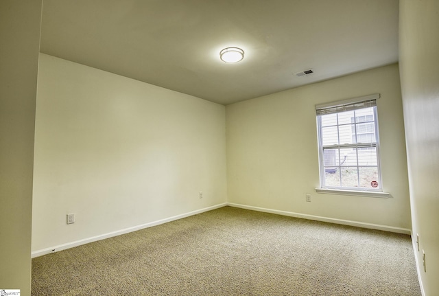 unfurnished room with carpet floors