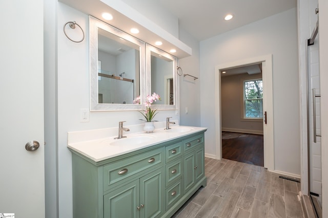 bathroom featuring vanity and hardwood / wood-style flooring