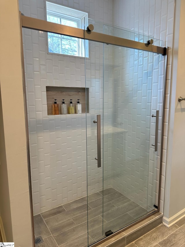 bathroom featuring an enclosed shower