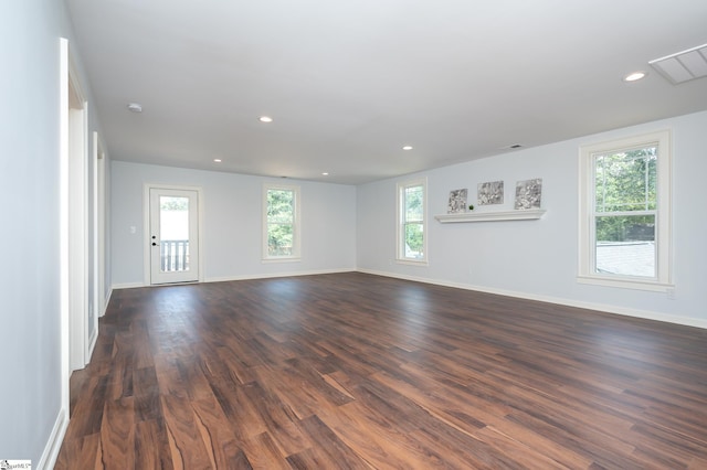 spare room with dark hardwood / wood-style flooring