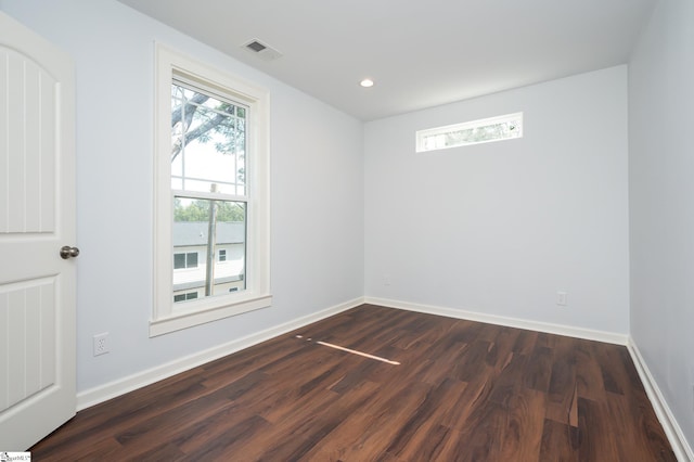 empty room with dark hardwood / wood-style floors