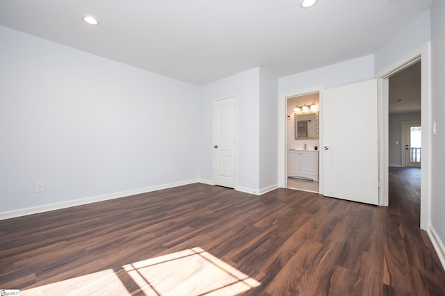 unfurnished room featuring dark hardwood / wood-style flooring