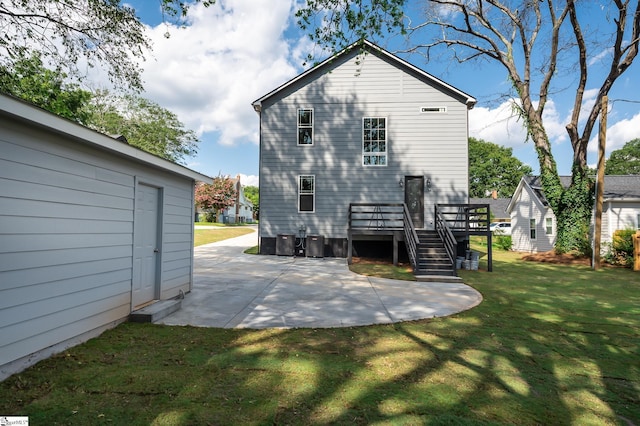 rear view of house with central AC, a lawn, a patio area, and a wooden deck