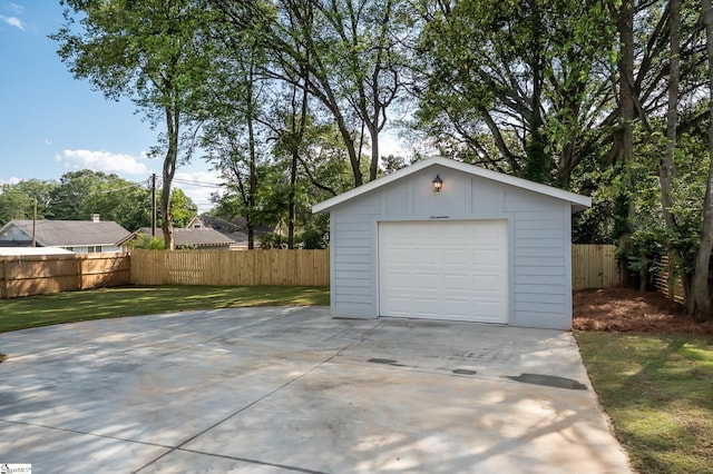 garage featuring a yard