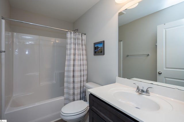 full bathroom featuring vanity, shower / tub combo, and toilet