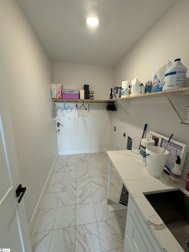 laundry area with washer hookup, sink, and electric dryer hookup