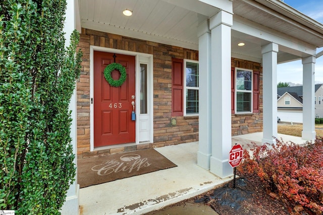 property entrance featuring a porch