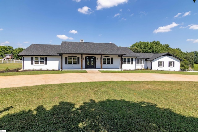 single story home with a front yard