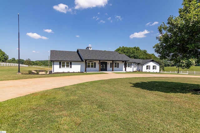 ranch-style house with a front lawn